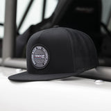 Tensor Race Badge Flatbill Trucker Hat | Snapback | Black